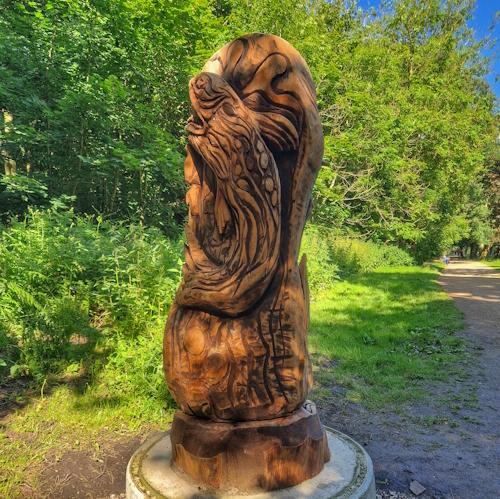 Wooden fish leaping, in woods