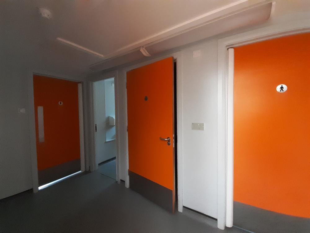 Orange toilet doors